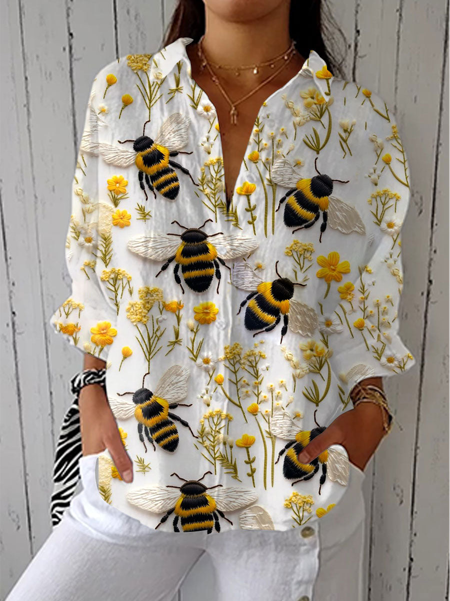 Yvonne – Blommig blus med bin i flera färger